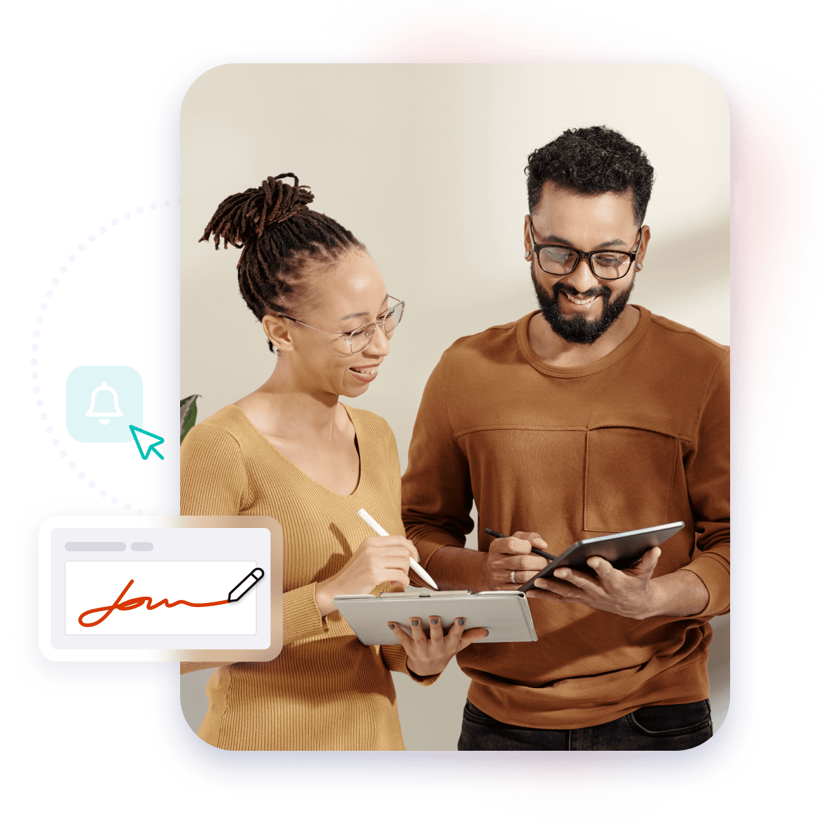 Two people smiling while signing with tablets